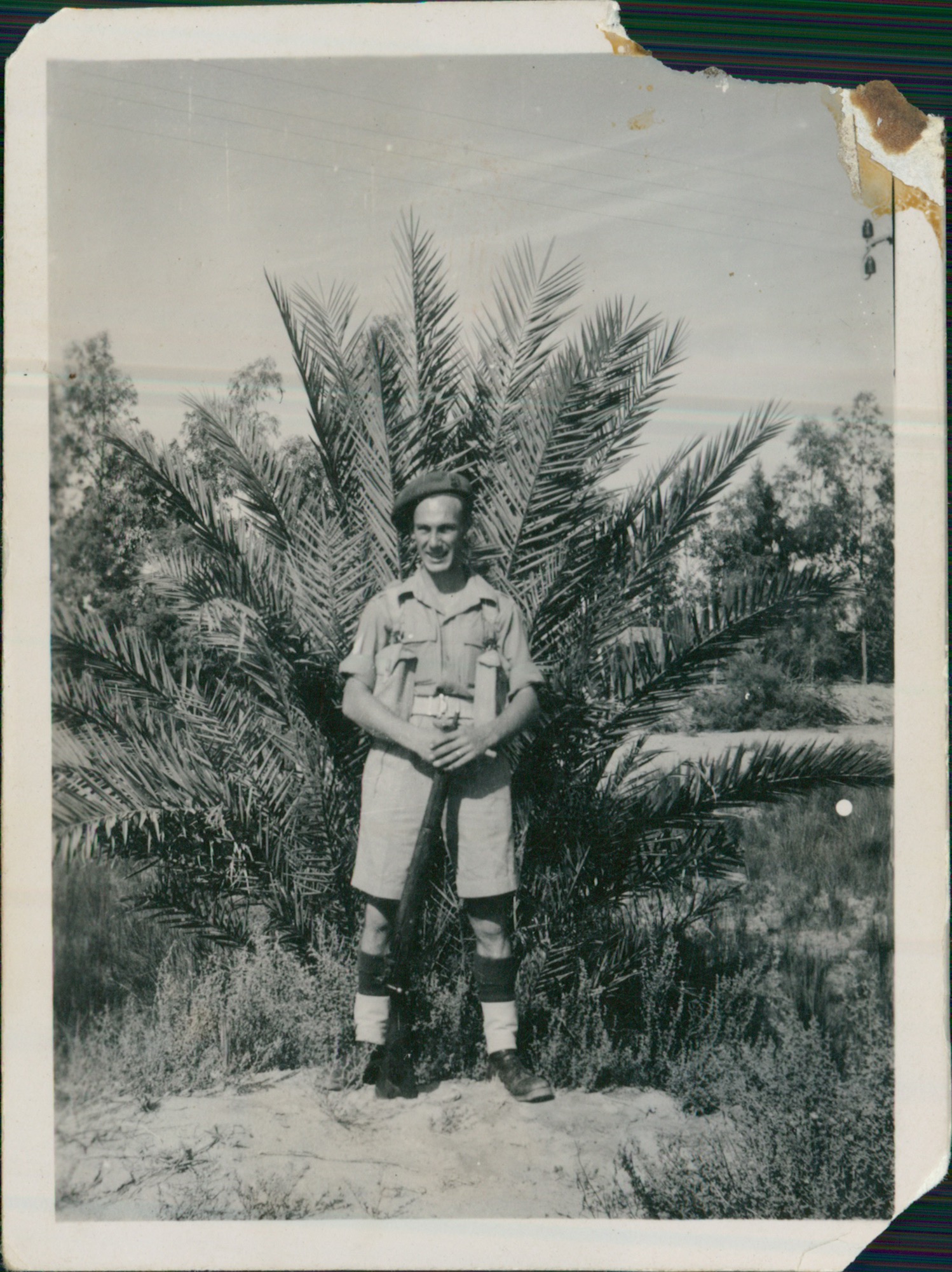 Charles Cable Savage in Khaki Drill uniform standing before a palm tree, photographed during his Middle East service, c.1946-47