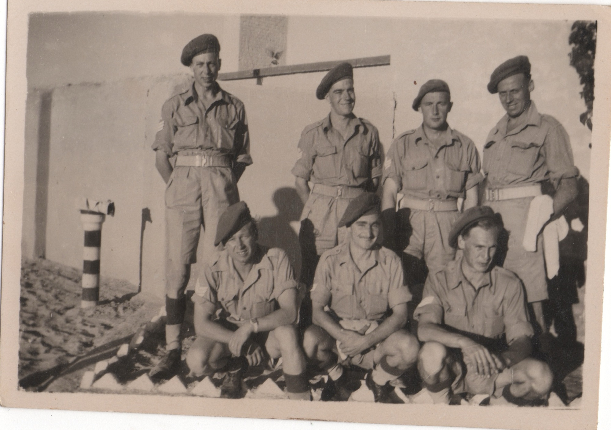 Charles Cable Savage standing on the far left, with six other British soldiers of the Royal Artillery in the Middle East, c.1945-46